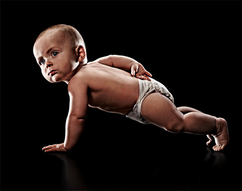 Baby pushups! Photo by Eric Sahrmann for a baby health campaign - source.